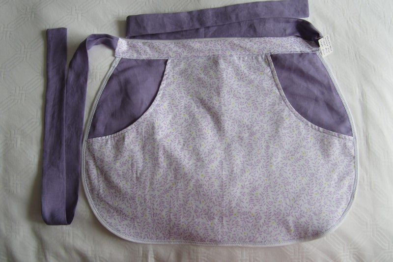 PEG APRON -Mauve with white pocket decorated with tiny sprigs of mauve flowers Carousel 1