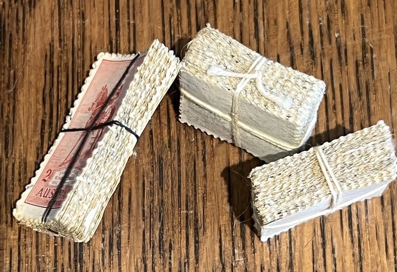 Three bundles of used, vintage Australian stamps, tied up with cotton thread Carousel 2