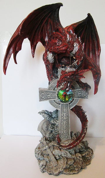 Red dragon on a large celtic cross Carousel 1