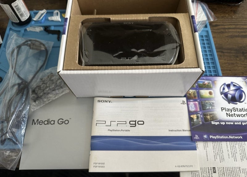 Boxed PSP GO + Charger Carousel 1