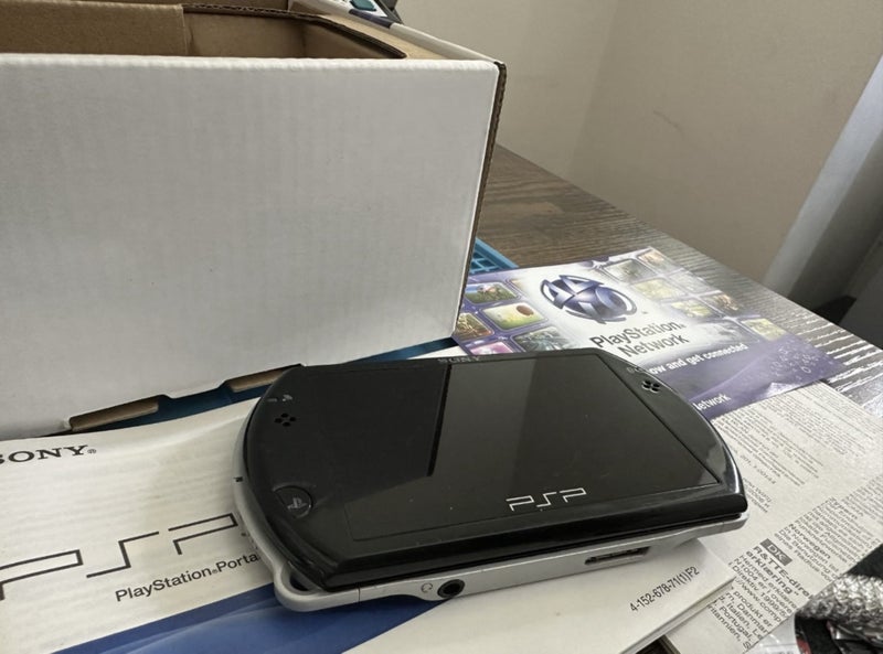 Boxed PSP GO + Charger Carousel 5