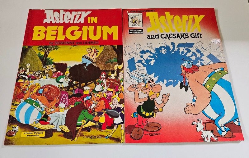 2 vintage soft cover Asterix Comics. Asterix in Belgium & Asterix & Caesars Gift Carousel 1