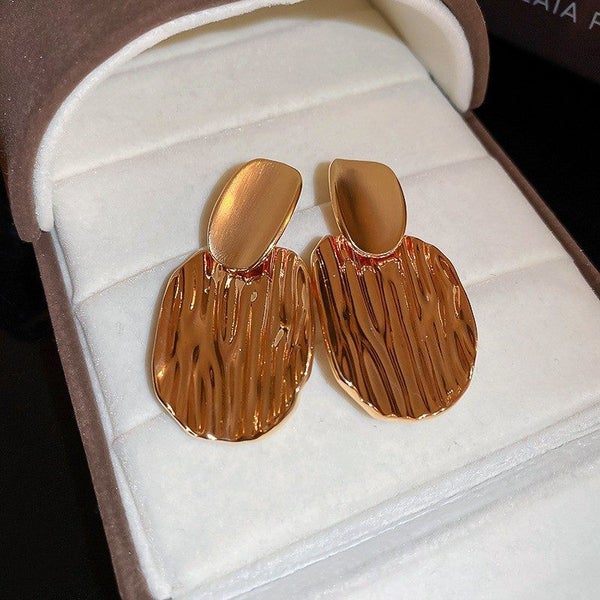 Gold Textured Drop Earrings – Elegant Wave Pattern Statement Jewelry Carousel 1