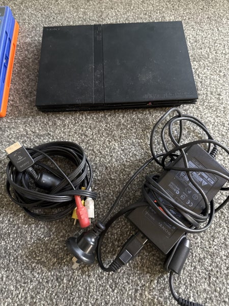 PlayStation 2 slim console with 3 games and controller Carousel 1