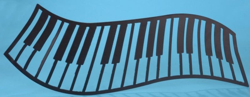 Black metal Piano keys wall hanging (blue is background only) 49cm x 18cm. Carousel 1