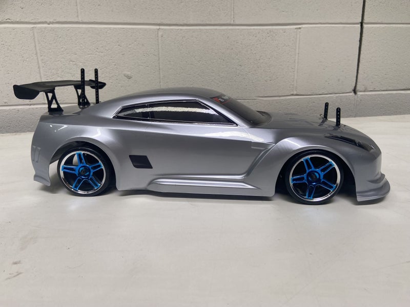 HSP Drift Car Nissan GTR . 1/10 Includes Bonus Battery, Wheels and Brace.62863857316739114