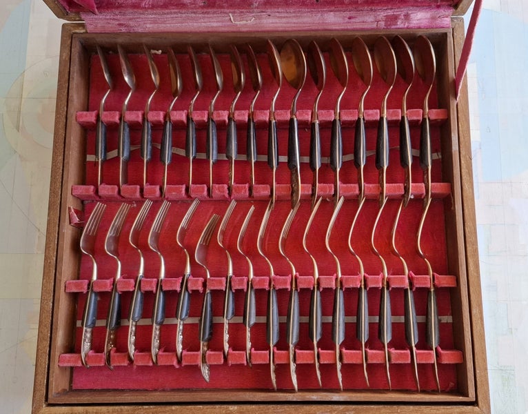 Approx 100 items of brass and wood cutlery Carousel 1