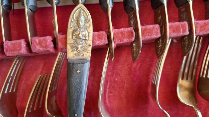 Approx 100 items of brass and wood cutlery Carousel 10