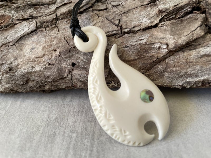 Hand-Carved Bone Fish Hook Pendant with Paua Shell Inlay Carousel 2