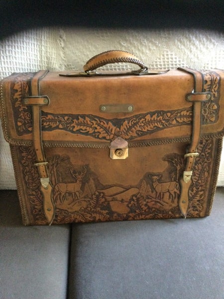 Hand carved solid leather bag. Carousel 1