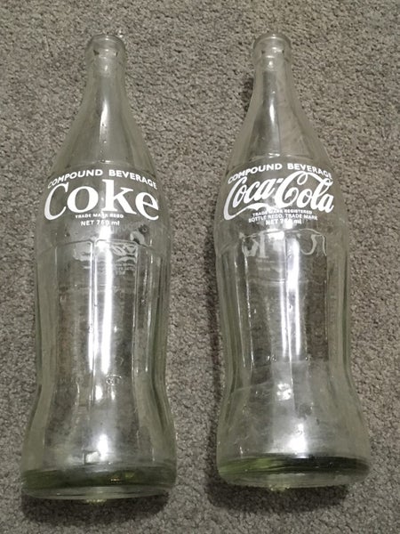 Coca-Cola / Coke vintage 750ml bottles x 2 as 1 lot Carousel 1