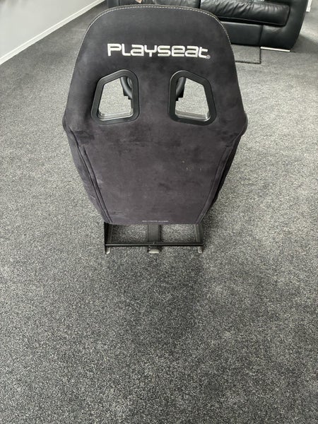 Playseat simulator chair with Logitech steering wheel and pedals Carousel 6