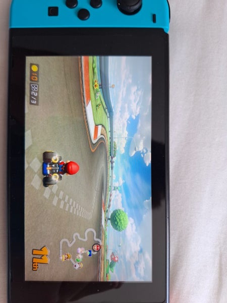 Nintendo Switch V2 + Mario Kart, Pro Controller Carousel 2