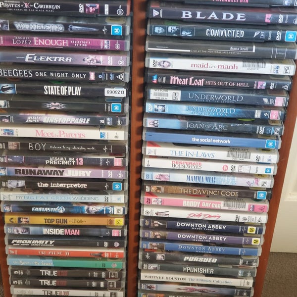 56 DVD,S COMES WITH SOLD WOOD STAND Carousel 1