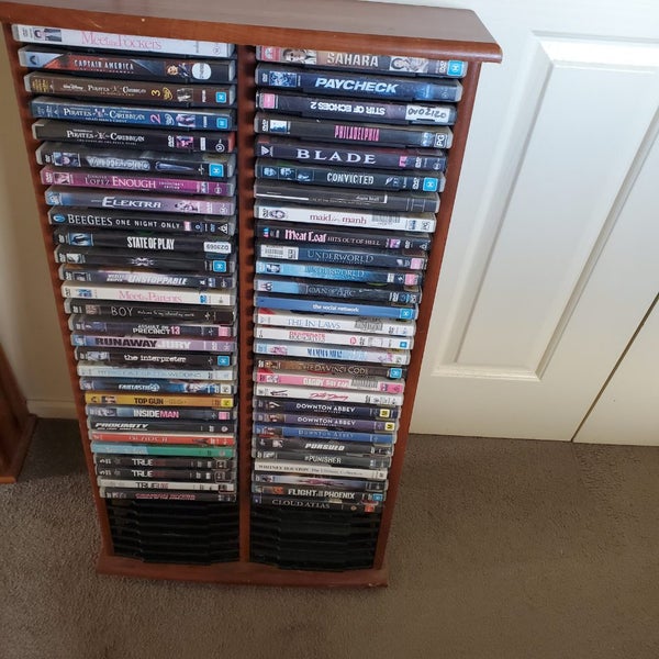 56 DVD,S COMES WITH SOLD WOOD STAND Carousel 2