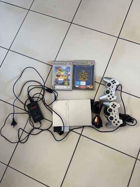 Playstaion2 silver console with 2controller 2title bundle Carousel 1