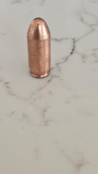 hand poured copper bullet. *not real bullet* Carousel 1