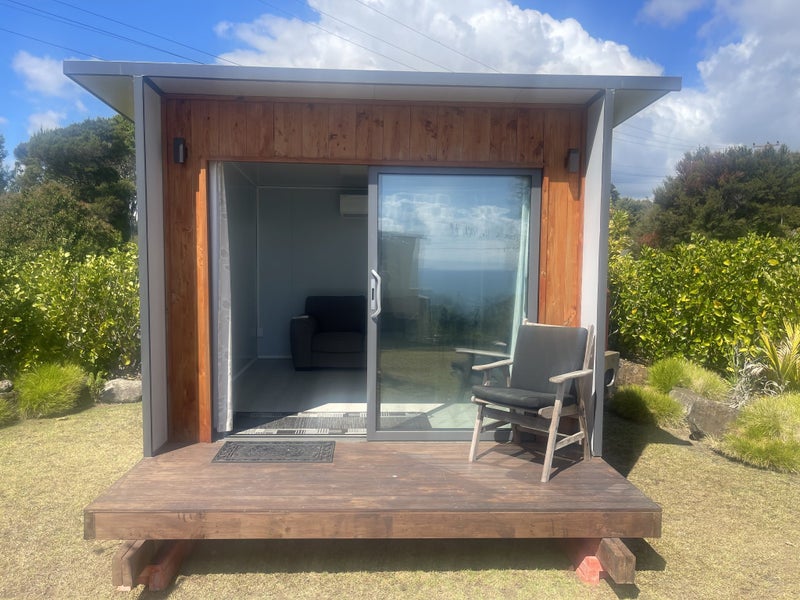 Tidy Cabin with heatpump, deck, lighting and power Carousel 1