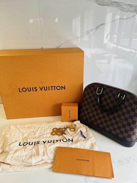 Louis Vuitton Alma PM plus the LV bag Charms62934717702274112