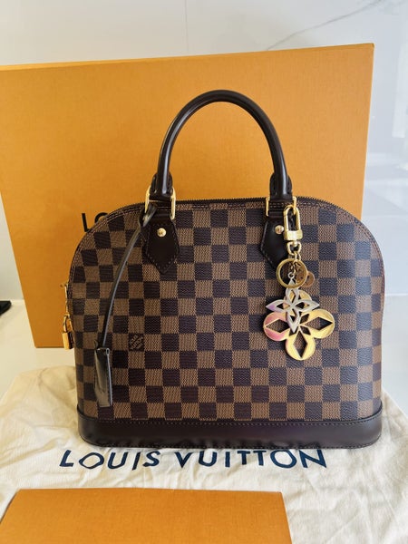 Louis Vuitton Alma PM plus the LV bag Charms62934717702274111
