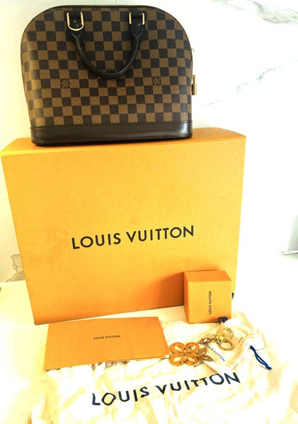 Louis Vuitton Alma PM plus the LV bag Charms62934717702274112
