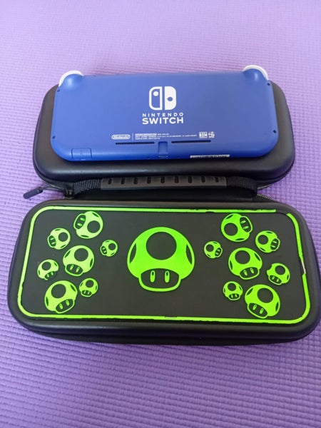 Blue Nintendo switch lite with glow-in-the-dark carry case Carousel 3