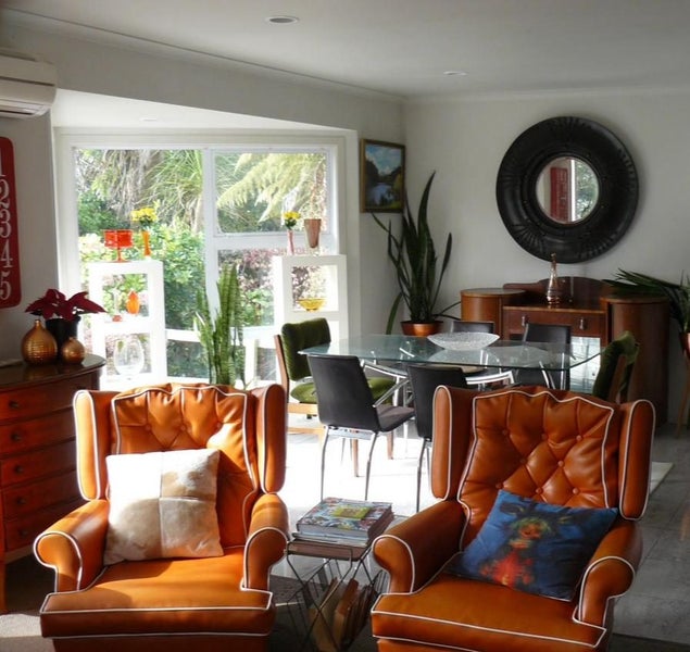 Two Orange Retro 1960s Chairs Carousel 1