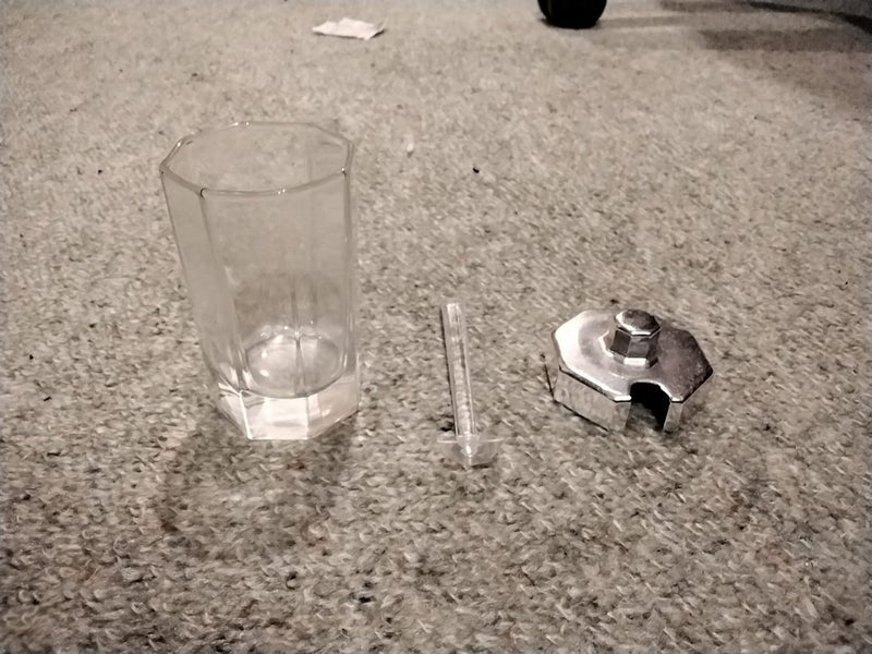 Glass jar, plastic spoon and metal lid Carousel 1