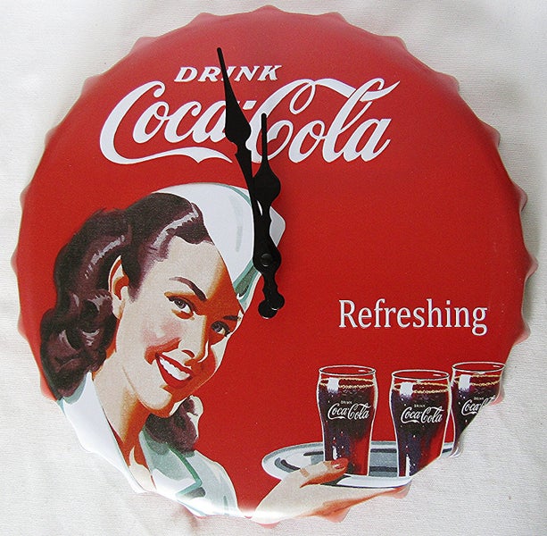 Coca Cola clock, bottle top shaped, 33cm across. Carousel 1