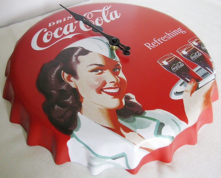 Coca Cola clock, bottle top shaped, 33cm across. Carousel 2