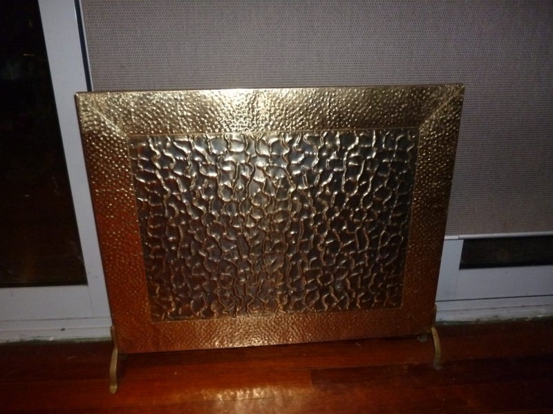 Antique brass embossed fireplace screen Carousel 1