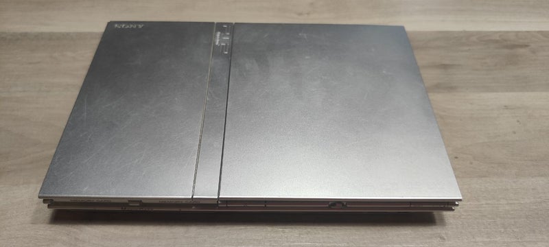 PlayStation 2 Silver Slim - Excellent Working Condition - Carousel 1
