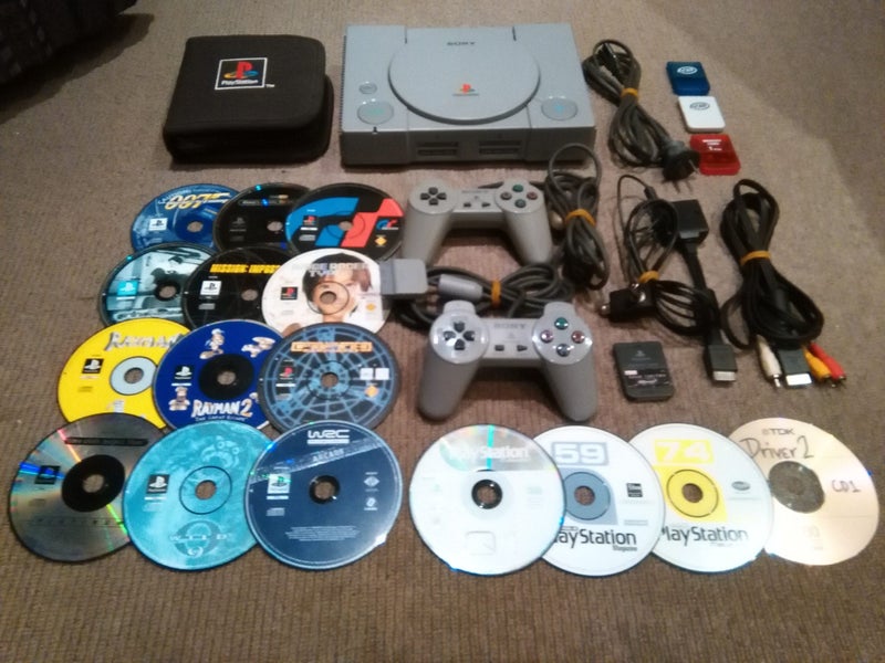 Hardware Modded Sony PS1 Console, Cables/Controllers PS1 CD Wallet, MC's & Games Carousel 1