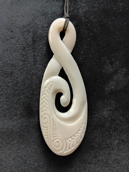 Medium Bone Carving Twist, with Koru, Pendant in Giftbox Carousel 1