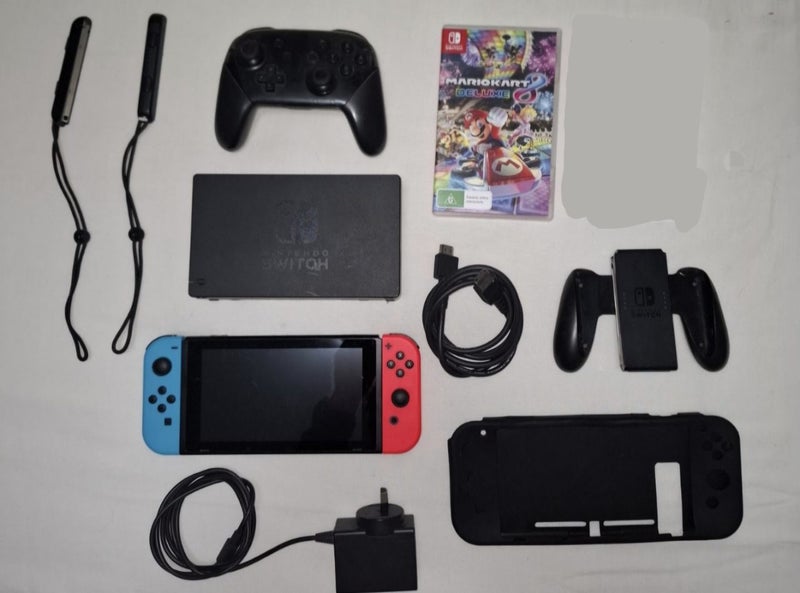 Nintendo Switch V2 + Mario Kart, Pro Controller Carousel 1