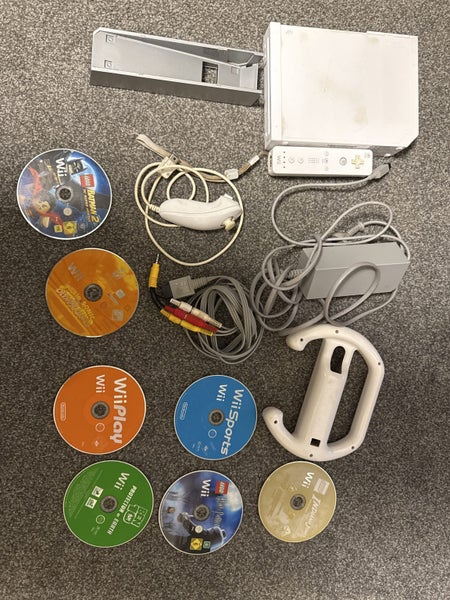 Wii console with controller and 7 games Carousel 1