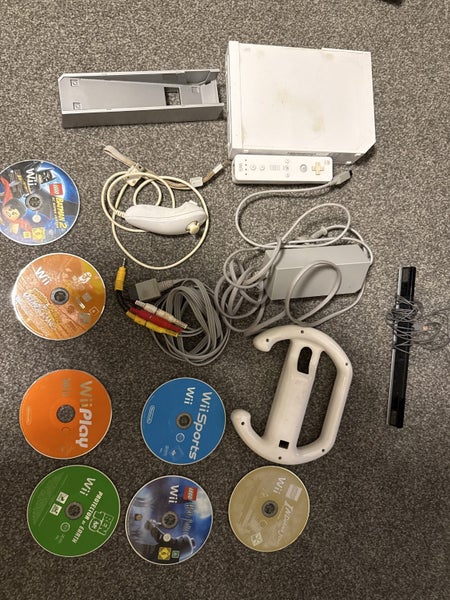 Wii console with controller and 7 games Carousel 5