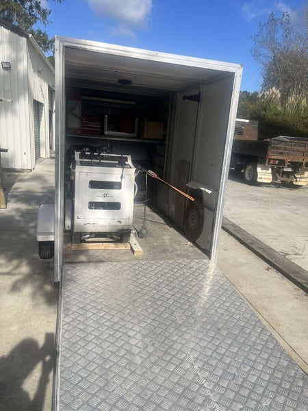 Concrete Saw and Enclosed Trailer Carousel 1