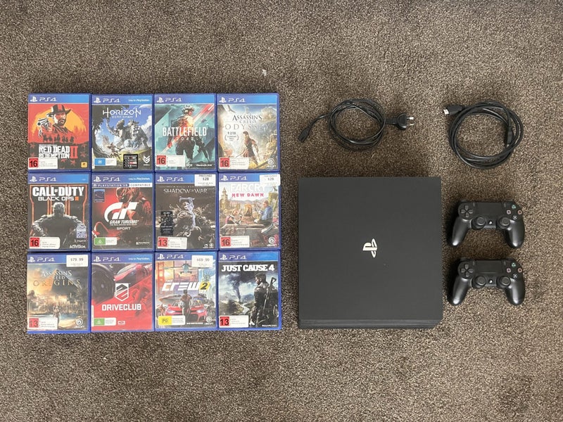 PS4 Pro 1TB + 12 Games + 2 Controllers Carousel 1