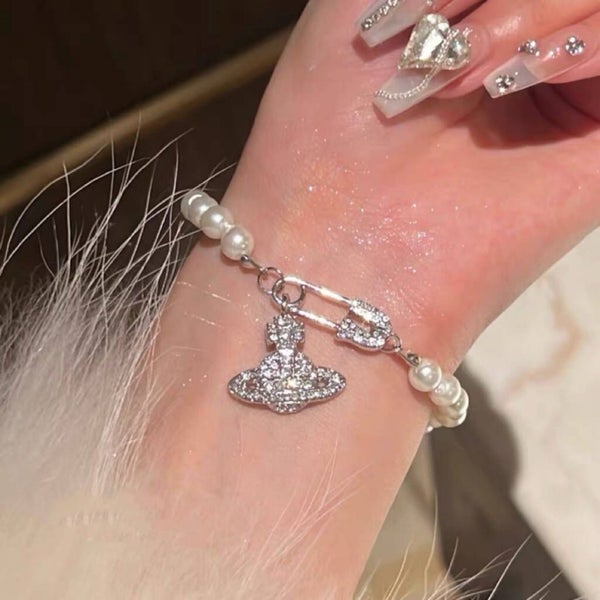Artificial Pearl Bracelet with Rhinestone Saturn and Safety Pin Accent Carousel 1