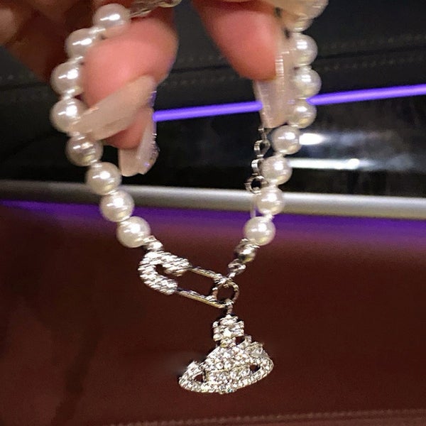 Artificial Pearl Bracelet with Rhinestone Saturn and Safety Pin Accent Carousel 3