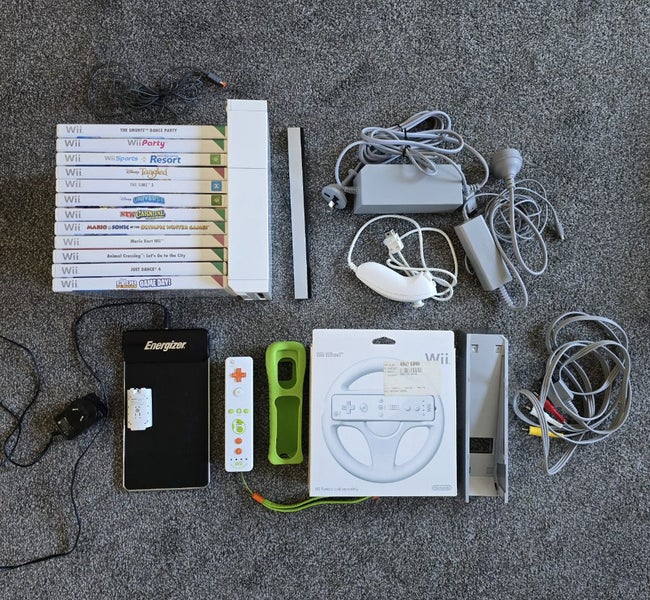 $1 RES! Nintendo Wii with controller, 12 games and accessories! Carousel 1