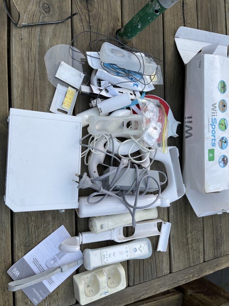 Wii console hand held controllers plus lots of other stuff Carousel 1