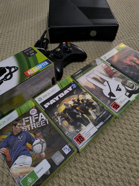 Xbox 360 Slim 250gb controller cords 2x resident evil and 2x complete games Carousel 1
