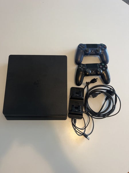 PS4 + controllers x2 with charging dock and power cords Carousel 1