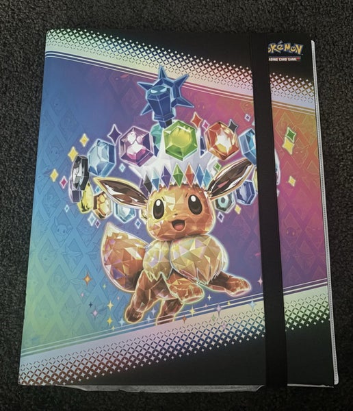 Prismatic evolution Pokemon card binder. NEW CONDITION Carousel 1