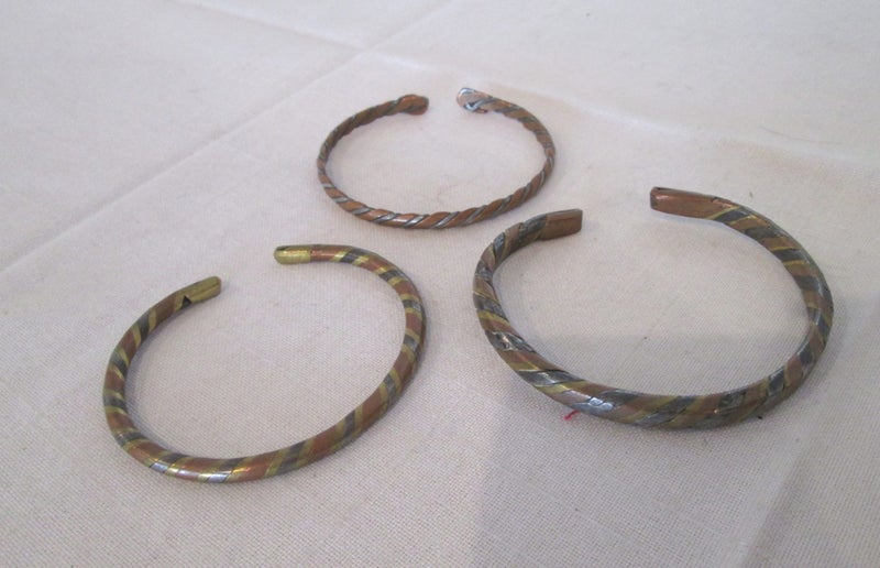 Three Multitoned Metal Cuff Bracelets Carousel 1