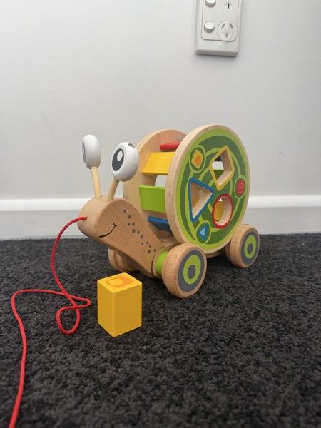 Hape Walk Along Snail Toy Carousel 1