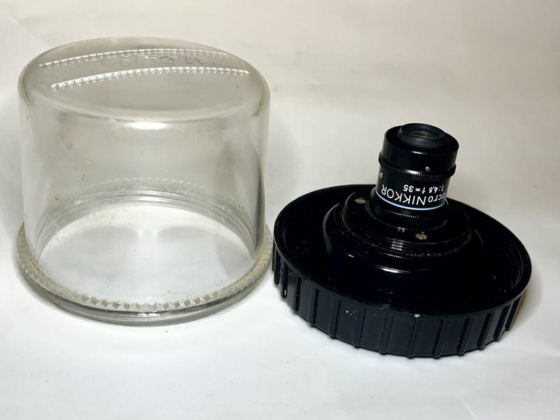 Macro Nikkor 35mm f4.5 ( + RMS to L39) contained in Nikon bubble case. Carousel 2