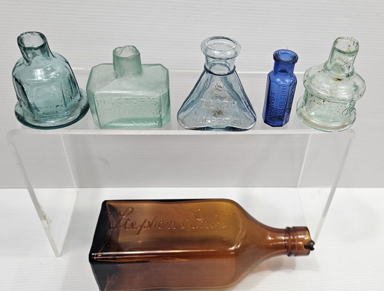 Collection of old Victorian embossed glass ink bottles Carousel 1